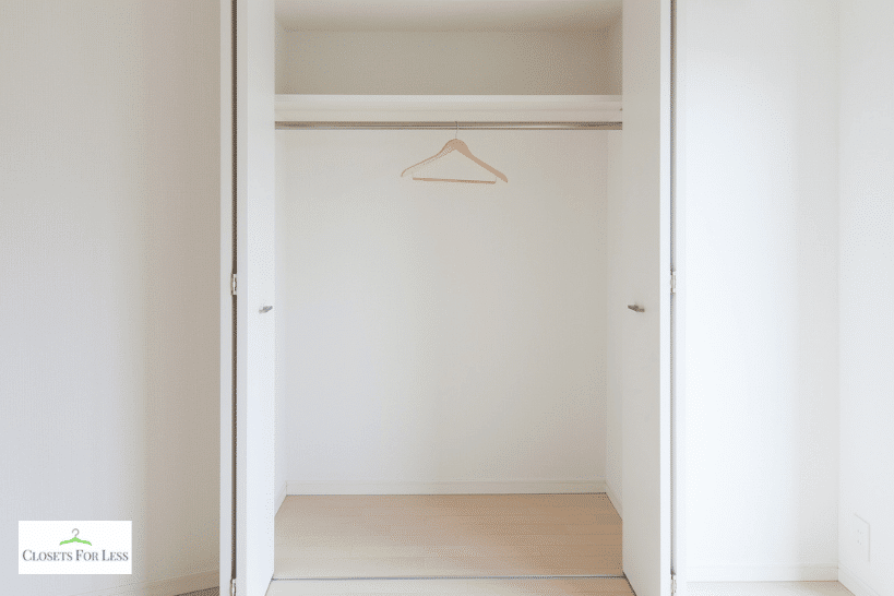 Peg rail system inside mudroom closet for flexible hanging storage
