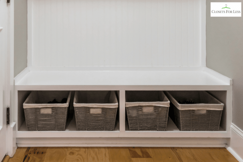 Pull-out storage crates under mudroom bench seating